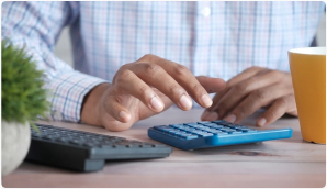 male_bookkeeper_typing_on_calculator