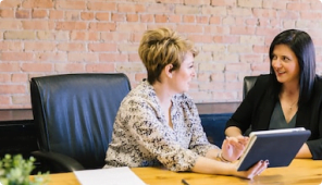 female_bookkeepers_talking_in_a_office